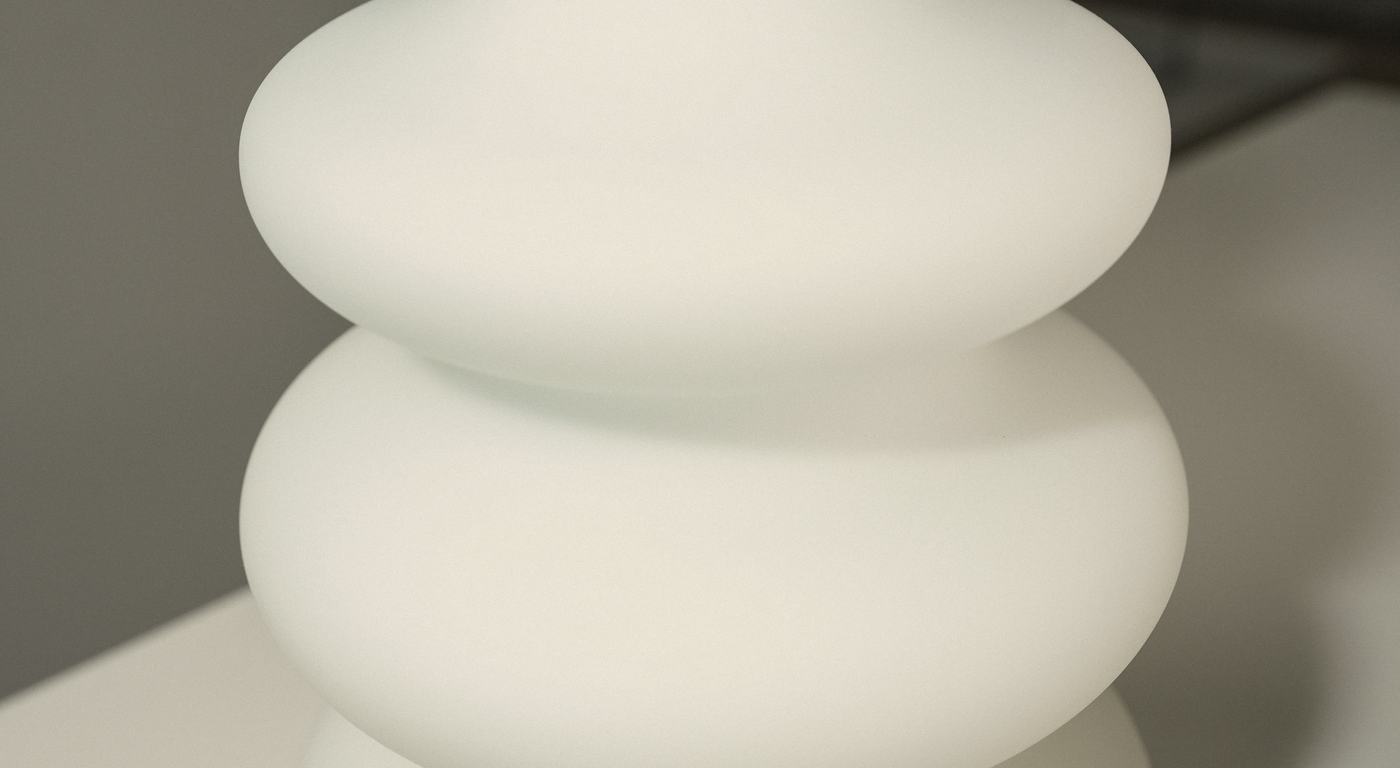 The soft, stacked curves of the handmade glass cover, in daylight